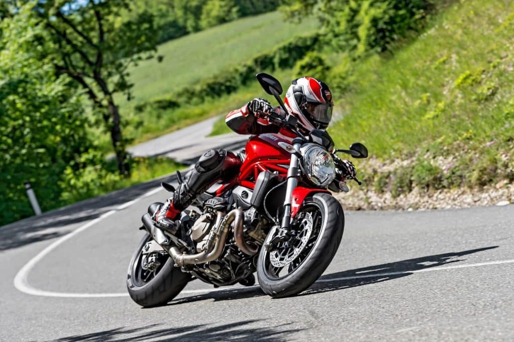 Red ducati monster 821 country road