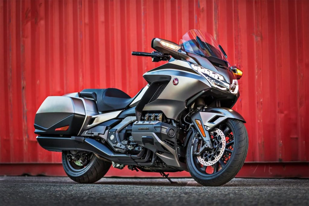2020 Honda Gold Wing with baggage in front of red wall