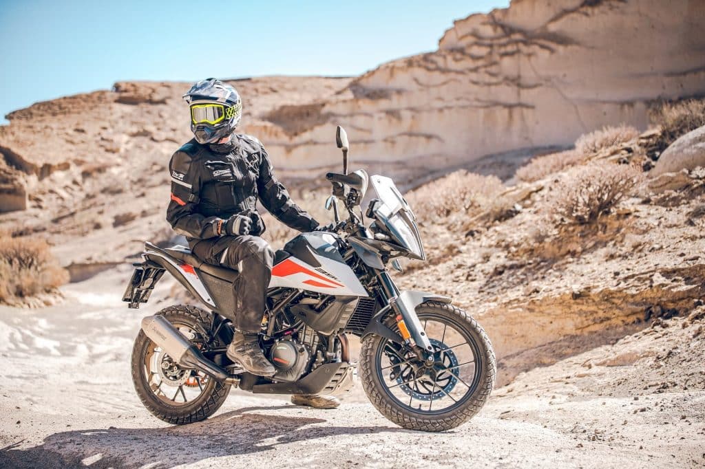KTM 390 Adventure 2020 parked outside with rider static web