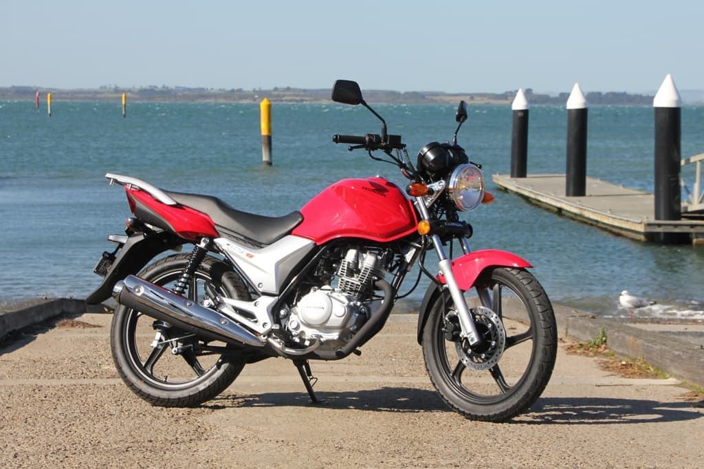 Red Honda CB125E on pier