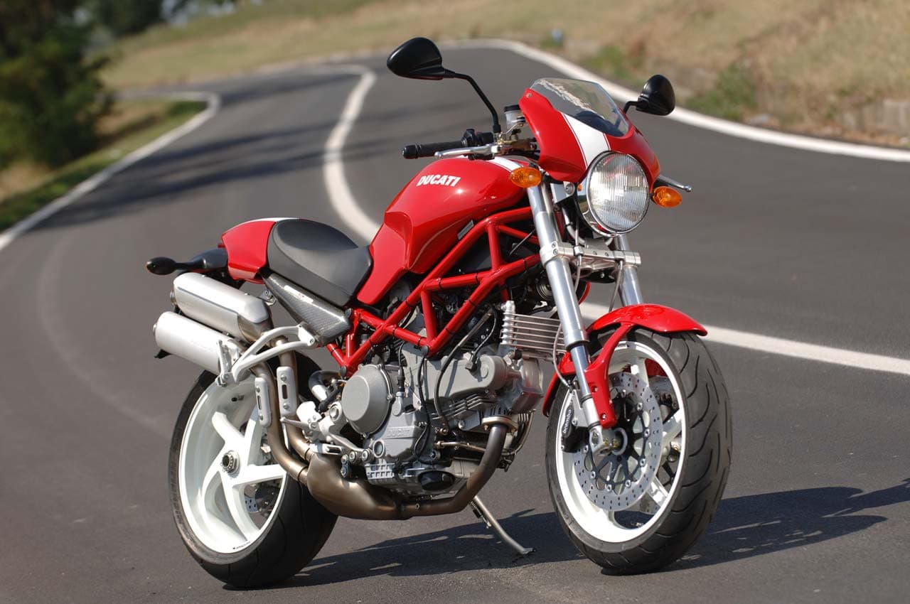 Red Ducati Monster S2R1000 on winding road RHS