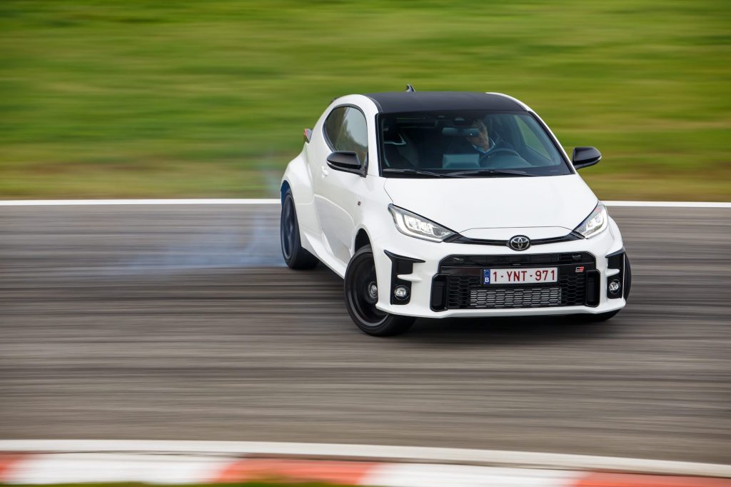 White Toyota GR Yaris sliding on racetrack